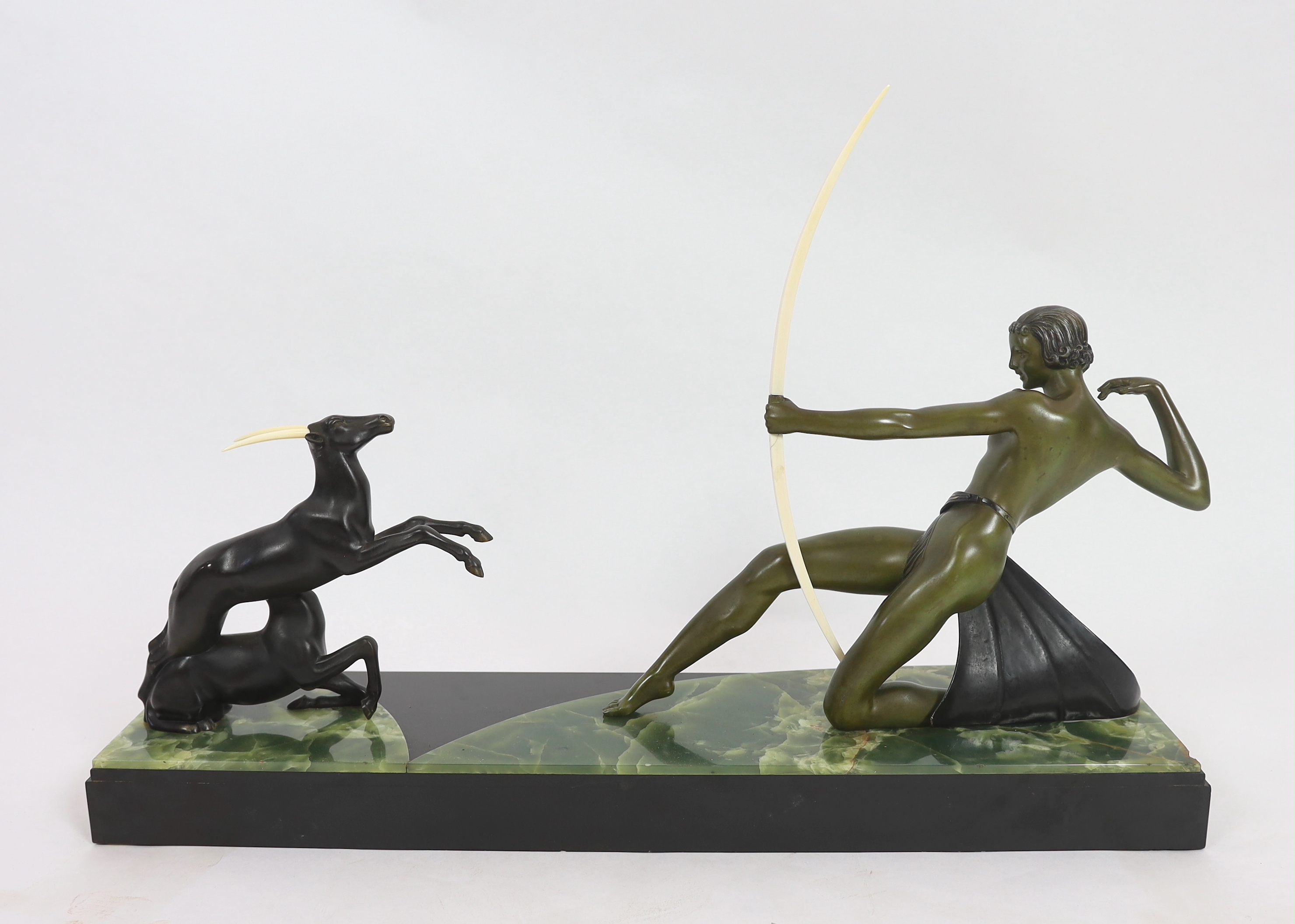 Attributed to Ugo Cipriani (Italian, 1887-1960). An Art Deco bronzed spelter group of an archer shooting at two antelopes, 82cm wide, 24cm deep, 55cm high